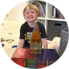 Boy with a temple he made out of blocks