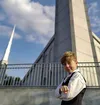 Smiling boy standing in front of temple