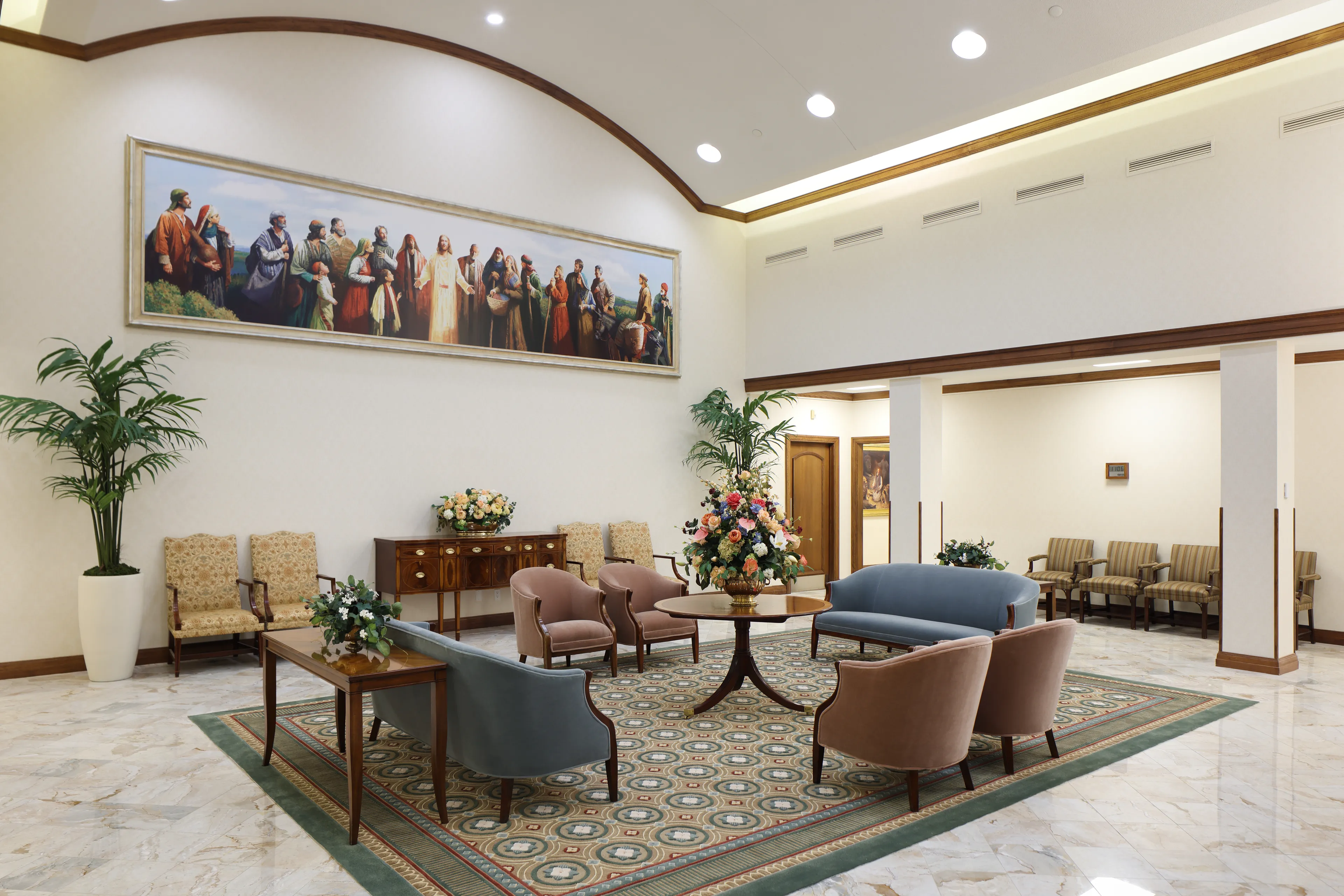 Interior image of the Toronto Ontario Temple featuring architectural details throughout the waiting room. There are chairs around the room and a large painting of the Savior is against one wall.  © undefined ipCode 1.
