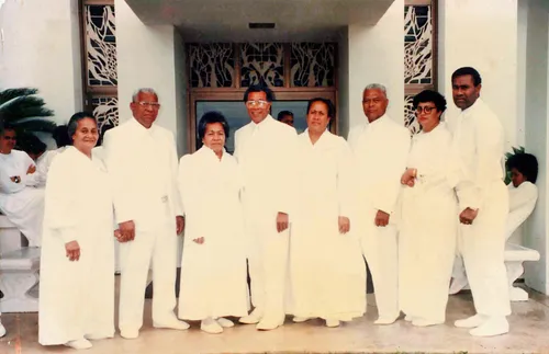 Taniela Wakolo and others outside a temple