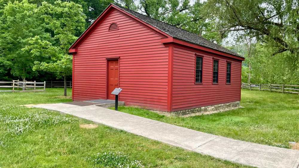 A small red building with red door.