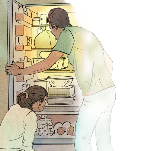 man and woman searching through a refrigerator
