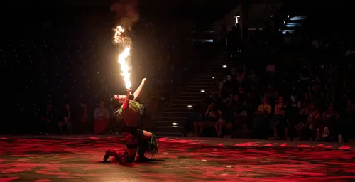 young man blowing fire