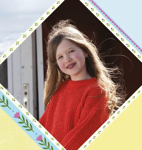 Photo of smiling girl in red sweater