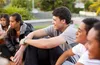 smiling youth sitting in a group