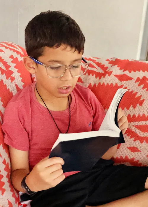 Boy reading the scriptures