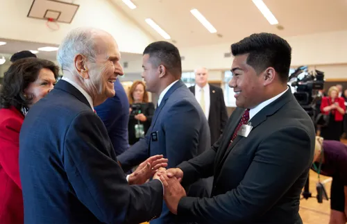 President Nelson shaking hands with a young missionary