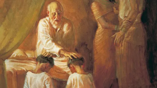 Jacob laying his hands on his sons’ heads to bless them