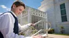young man entering the Louisville Kentucky Temple with family history cards