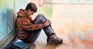 boy sitting in hallway