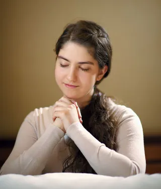 young woman praying