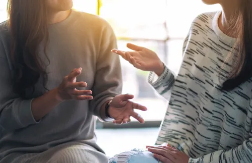 two women talking to each other