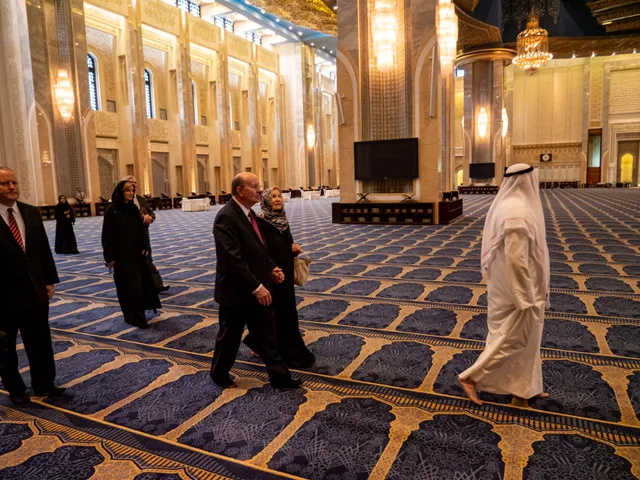Elder Quentin L. Cook and his wife, Mary, take a tour of the Grand Mosque hosted by the manager of the Western Perception of Islam Center, Mohammad Al-Meteb in Kuwait City.