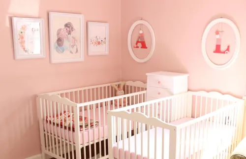 a painting of the Savior hanging over two cribs