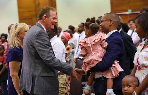 Elder Gary E. Stevenson greeting people in Tanzania