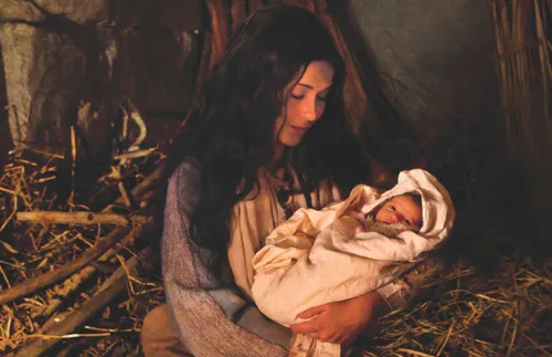 Mary smiling at the baby Jesus
