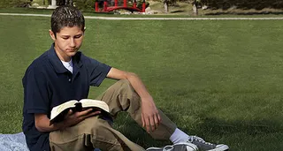 boy reading scriptures