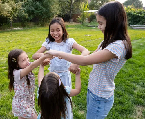 Image of children holding hands in a circle