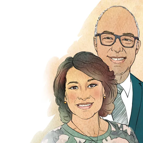 man and woman standing together smiling