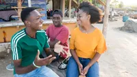 Jamaica: Young Adults Outside by Ocean