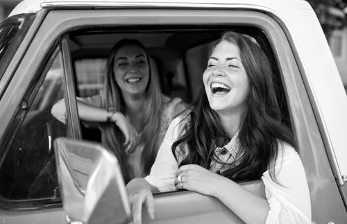 girls laughing in a car