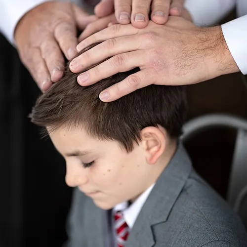 young man with hands on his head