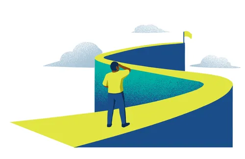 young man looking at ascending, winding path