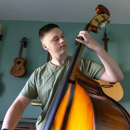 young man playing upright double bass