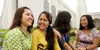 women sitting on temple grounds