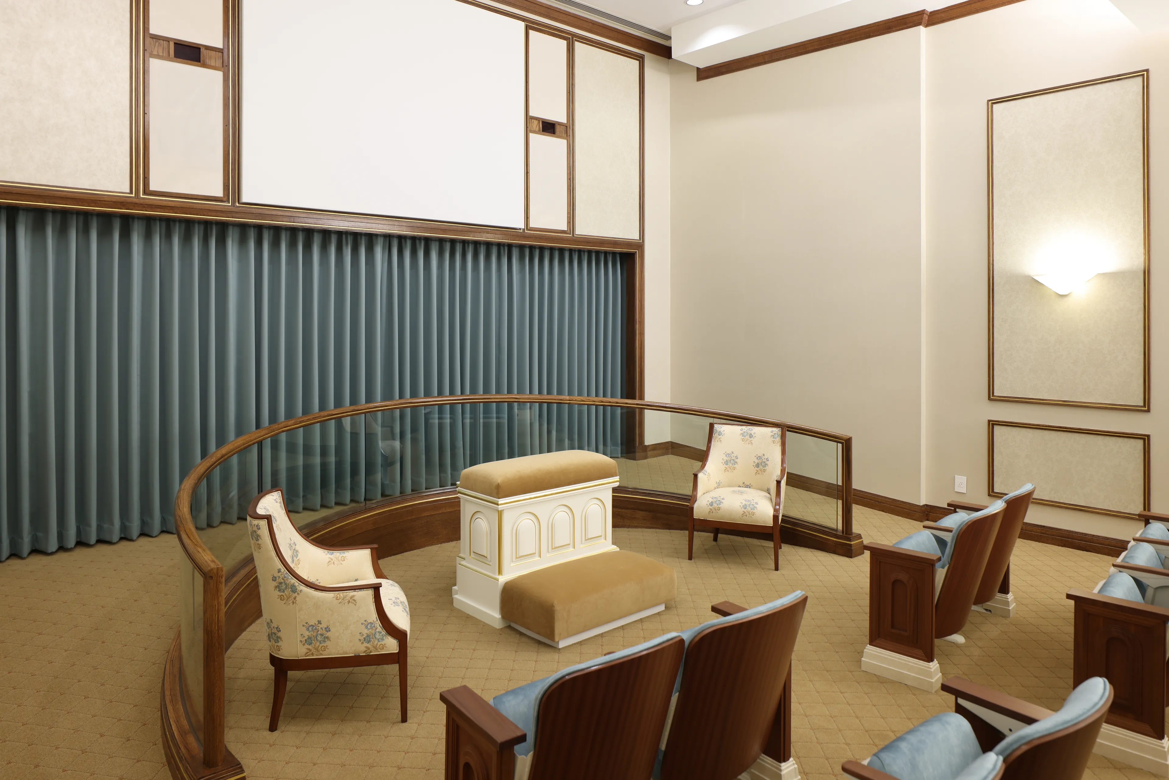 Interior image of the Toronto Ontario Temple inside the Chapel. The image highlights the pews around the room with the altar and veil.  © undefined ipCode 1.