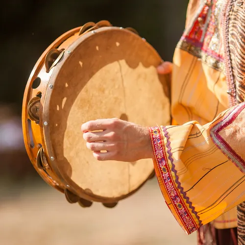 person playing tambourine