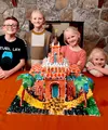 Four siblings with a temple made from gingerbread