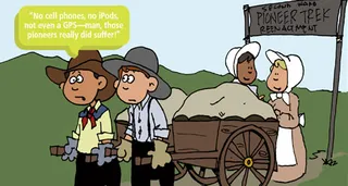 two boys pulling a handcart