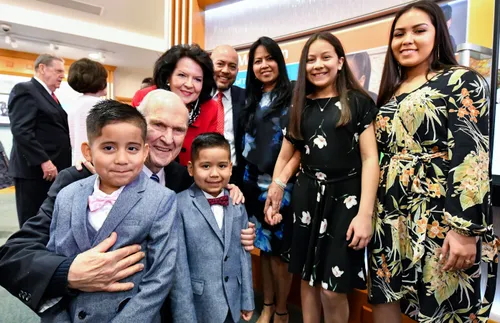 President and Sister Nelson greeting members in England
