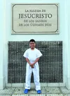 Boy in baptismal jump suit outside of church building