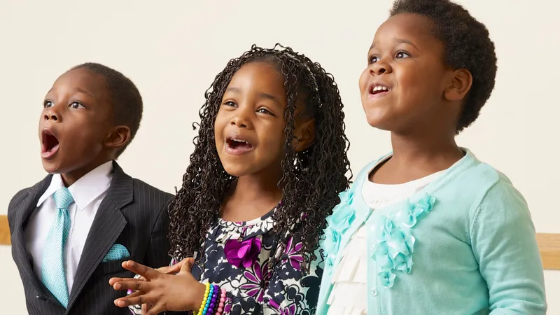 Children standing and singing in Primary sharing time.