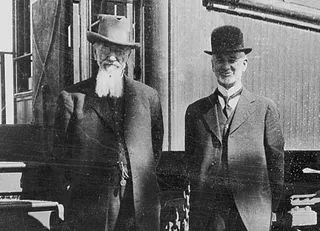 President Joseph F. Smith and Presiding Bishop Charles W. Nibley at a railroad stop