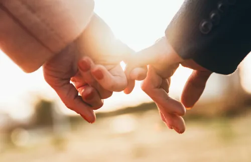 hands linked together