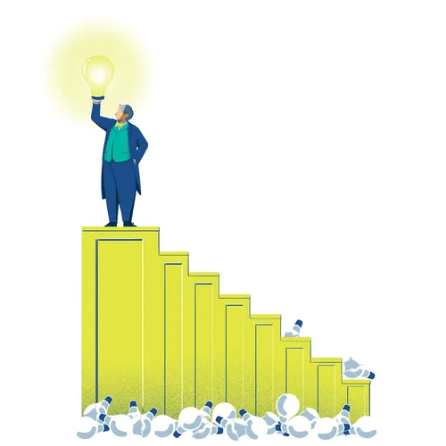 man holding lightbulb at top of stairs