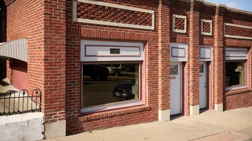 Exterior image of the David Whitmer homesite. Image features a brick building in Richmond, Missouri.