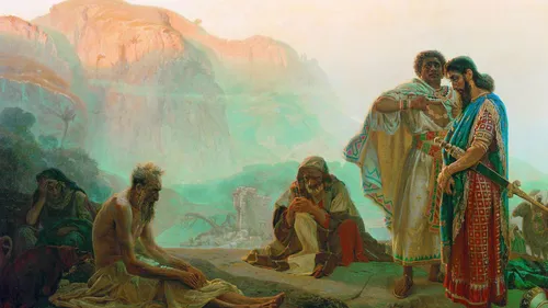 Job sitting on the ground while his friends stand nearby