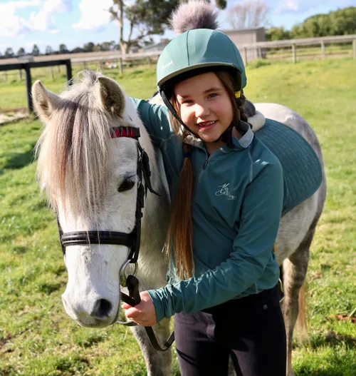 Image of Lirael standing next to a horse