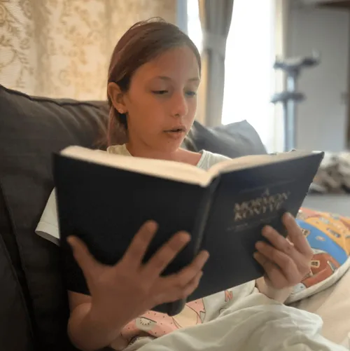 Girl reading the scriptures