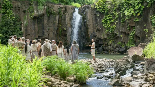 Alma teaching at the Waters of Mormon.