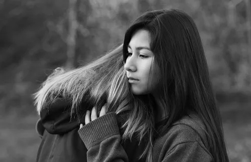 young women embracing