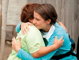 woman and girl hugging