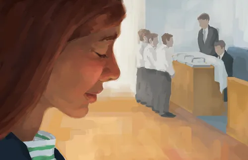 a young woman bowing her head while the sacrament is being blessed in the background