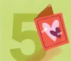 A greeting card with hearts on the front