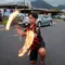 young man twirling a torch