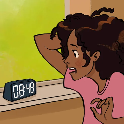 young woman looking at her alarm clock